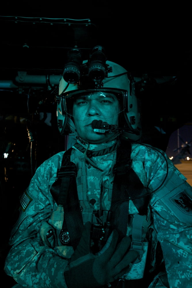 UH-60 Black Hawk crew chief in the cockpit Canvas Art - Terry MooreStocktrek Images (23 x 35)
