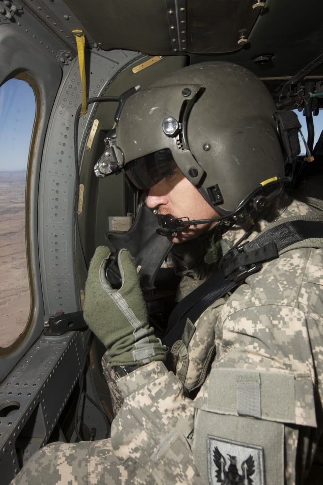UH-60 Black Hawk crew chief looking out the window while in flight Canvas Art - Terry MooreStocktrek Images (23 x 35)