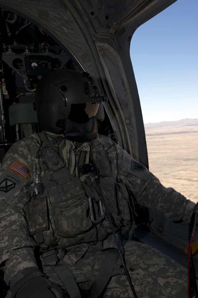 UH-60 Black Hawk crew chief takes in the view over New Mexico Canvas Art - Terry MooreStocktrek Images (12 x 18)