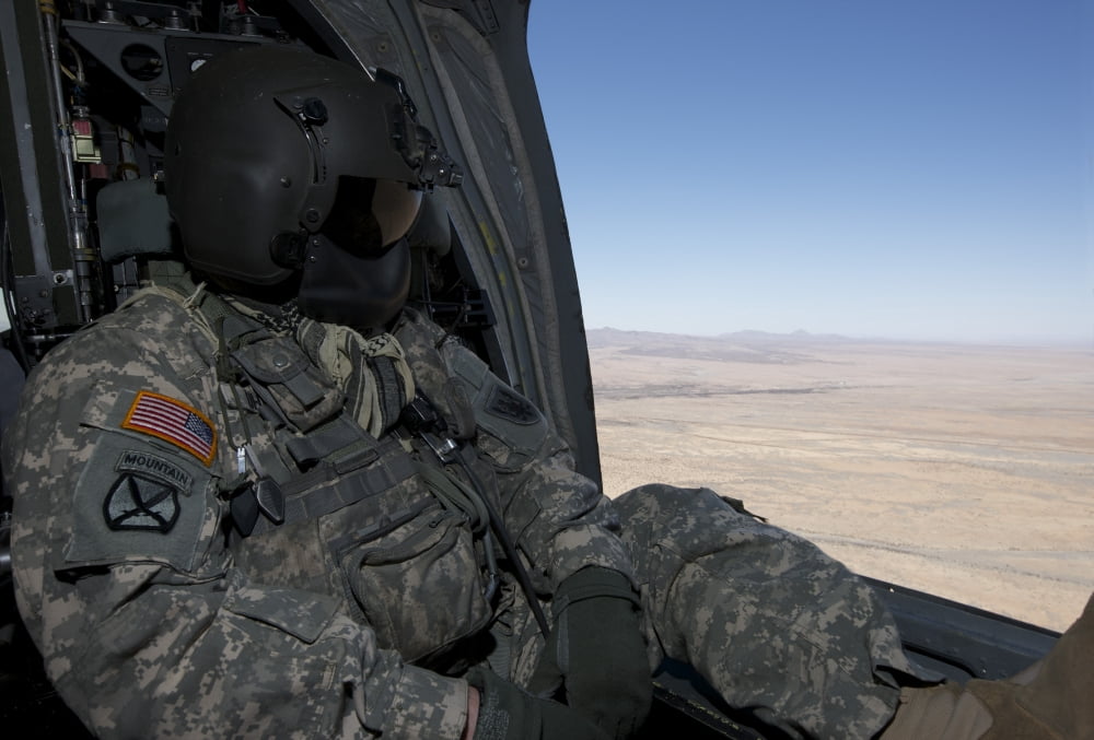 UH-60 Black Hawk crew chief takes in the view over New Mexico Canvas Art - Terry MooreStocktrek Images (34 x 23)