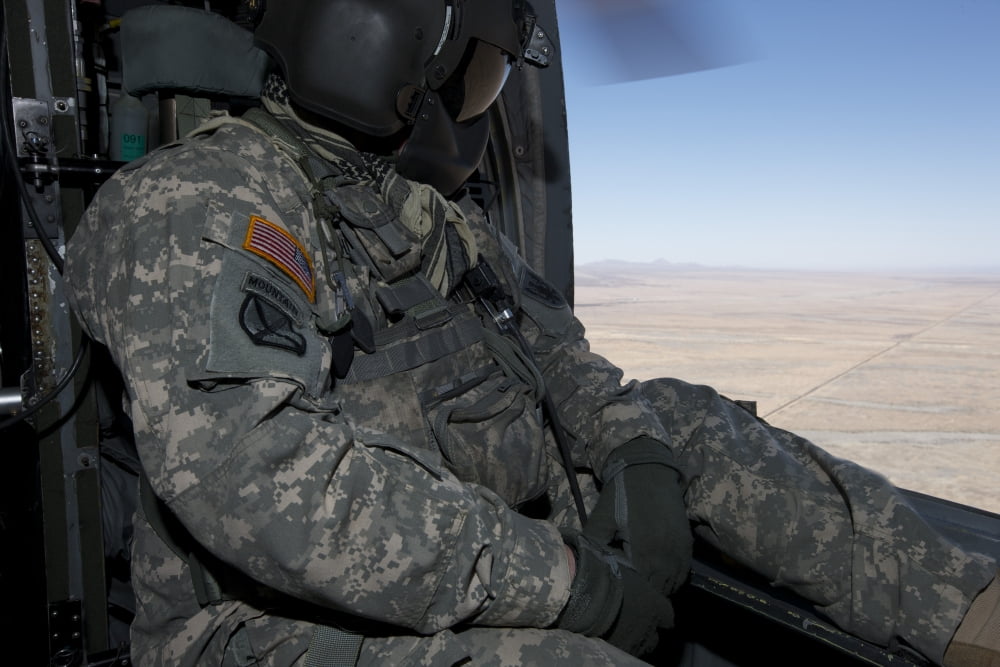 UH-60 Black Hawk crew chief takes in the view over New Mexico Canvas Art - Terry MooreStocktrek Images (35 x 23)