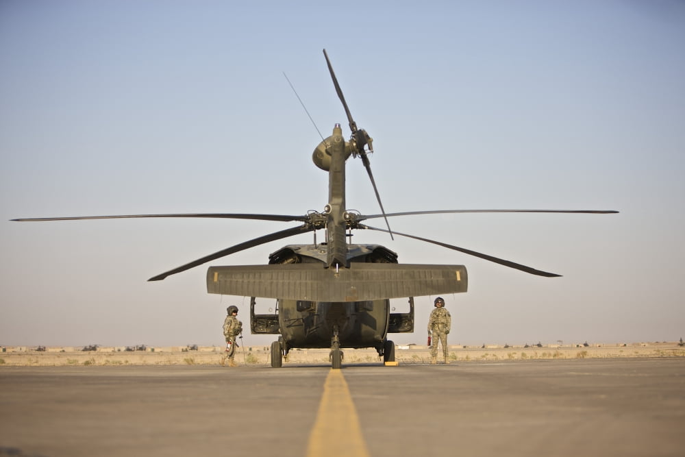 UH-60 Black Hawk flight crew members standby with fire extinguishers Canvas Art - Terry MooreStocktrek Images (35 x 23)