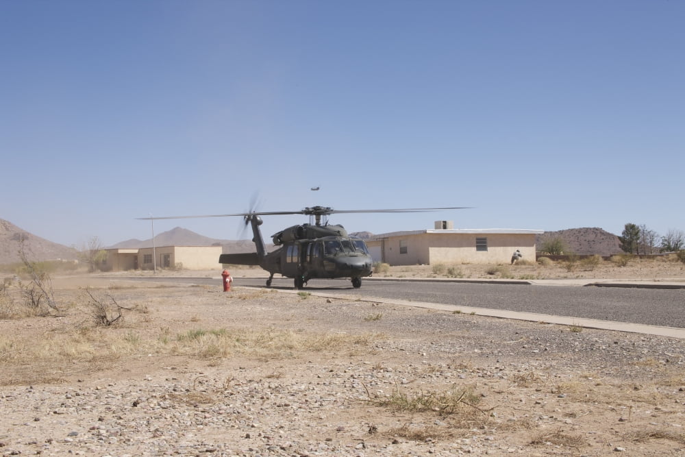 UH-60 Black Hawk helicopter lands on the street in New Mexico Canvas Art - Terry MooreStocktrek Images (35 x 23)