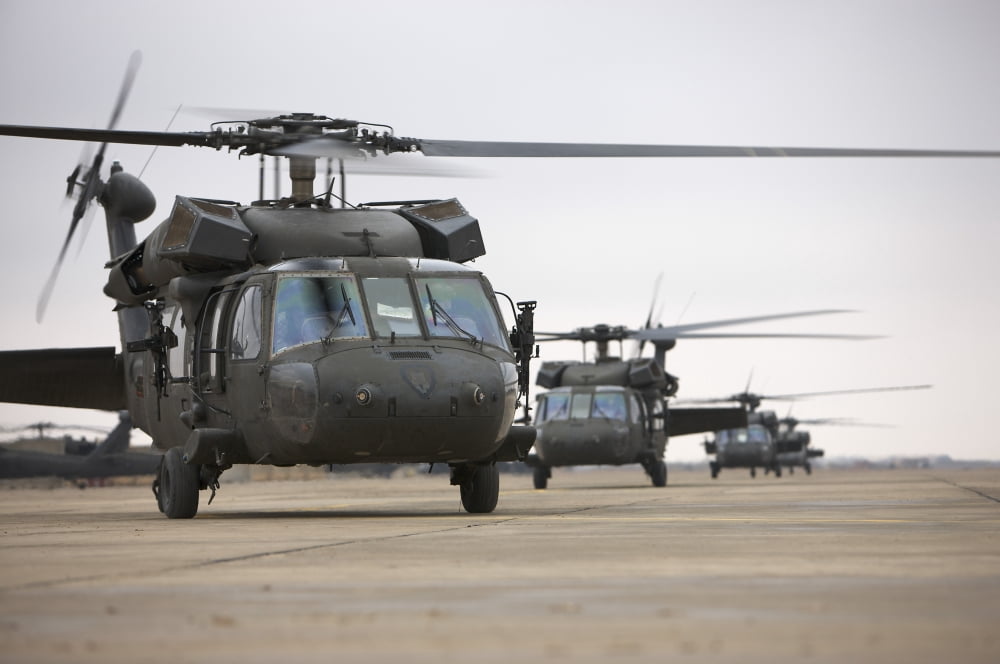 UH-60 Black Hawks taxis out for a mission over northern Iraq Canvas Art - Terry MooreStocktrek Images (18 x 12)
