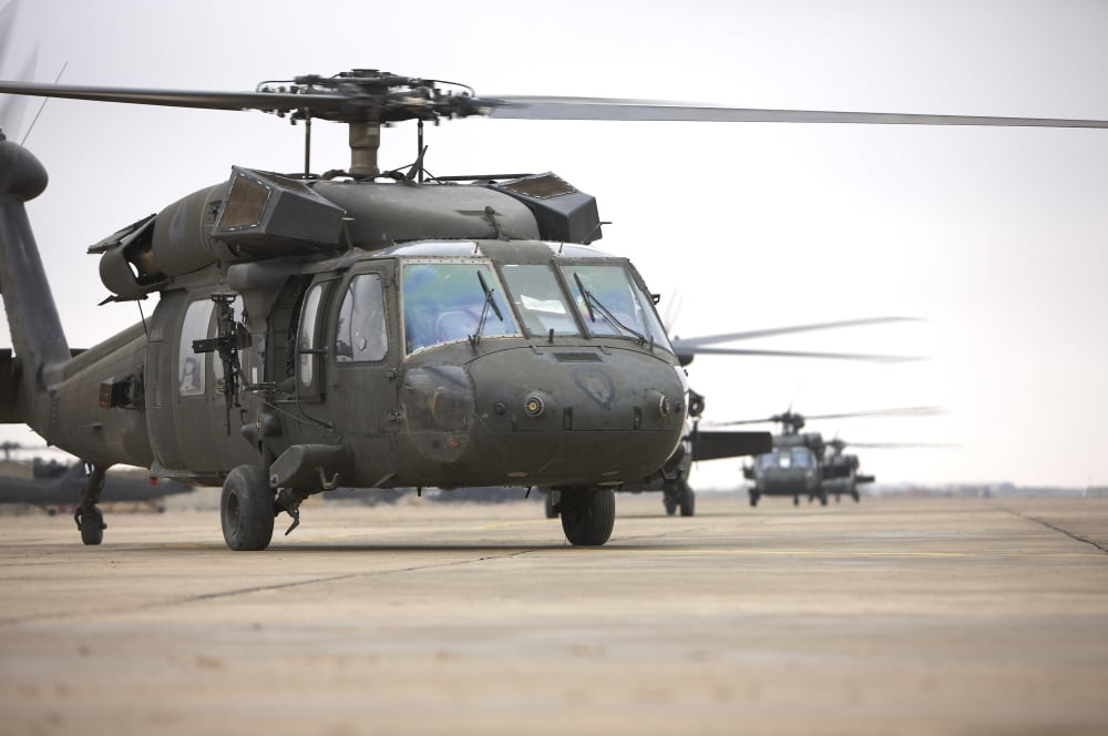 UH-60 Black Hawks taxis out for a mission over northern Iraq Canvas Art - Terry MooreStocktrek Images (18 x 12)