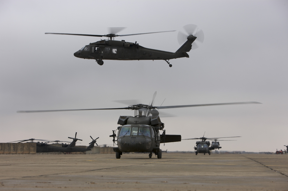 UH-60 Black Hawks taxis out for a mission over northern Iraq Canvas Art - Terry MooreStocktrek Images (35 x 23)