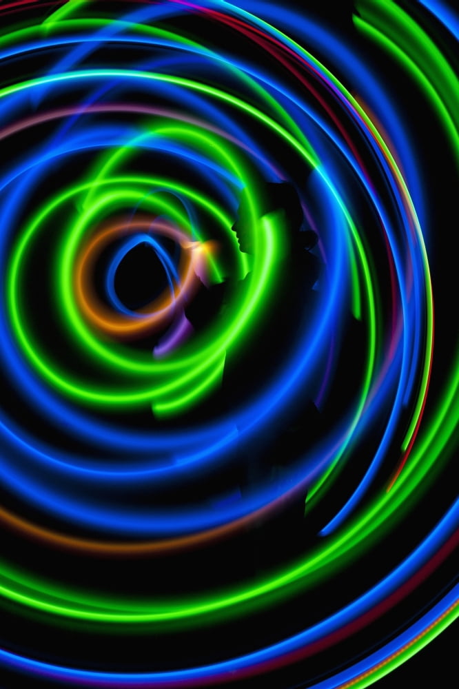 UK Silhouette of woman spinning hula-hoop lit with LEDs in field at night West Sussex Canvas Art - Ian Cumming Design Pics (12 x 19)