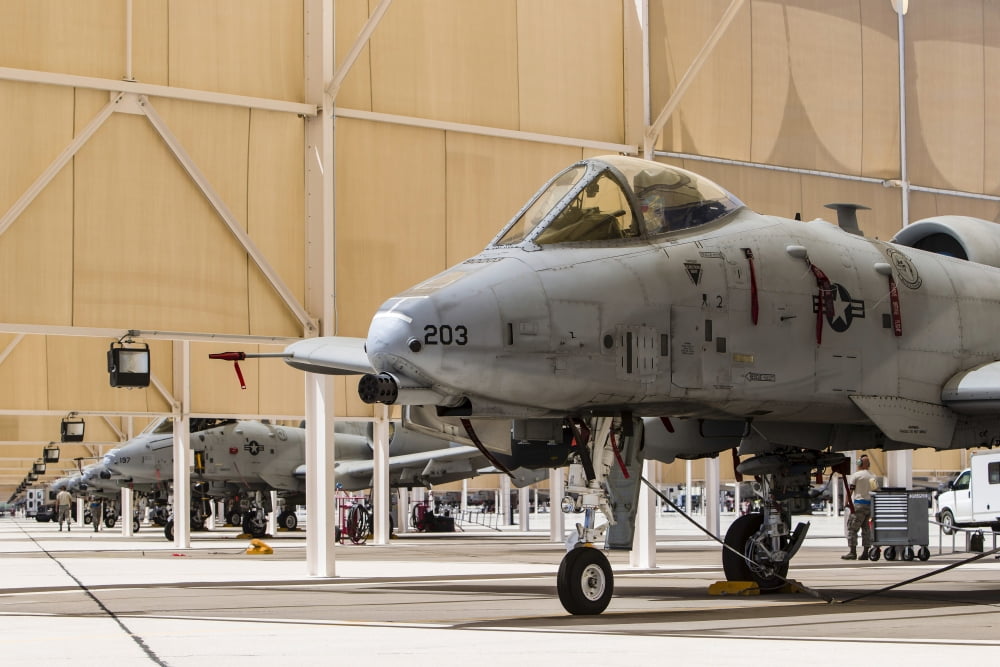 US Air Force A-10 Thunderbolt II aircraft sit in the sun shelters Canvas Art - Rob EdgcumbeStocktrek Images (17 x 12)