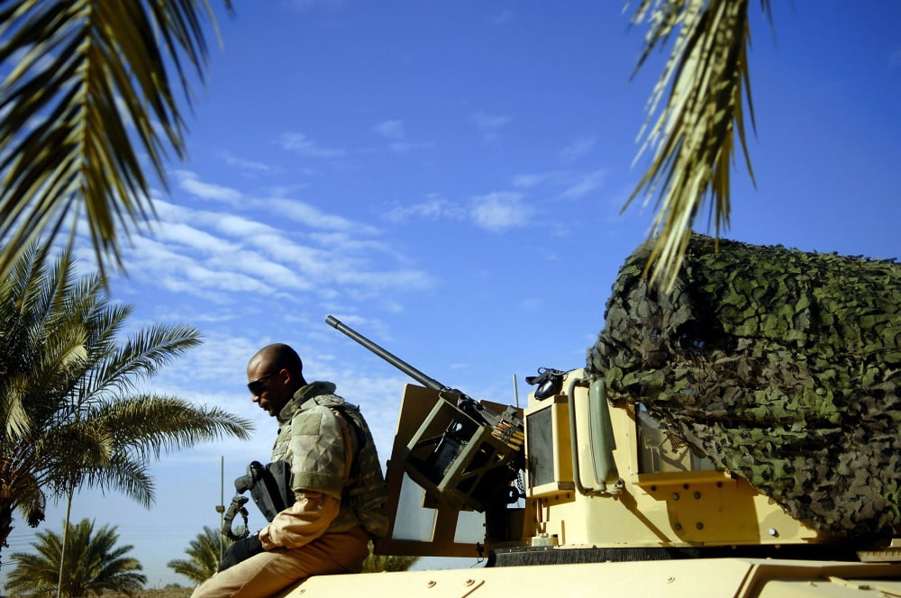 US Air Force Airman sits on his tactical vehicle Canvas Art - Stocktrek Images (34 x 23)