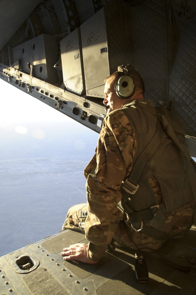 US Air Force Commander sits harnessed on the back ramp of an Afghan Air Force C-27 Spartan Canvas Art - Stocktrek Images (23 x 34)