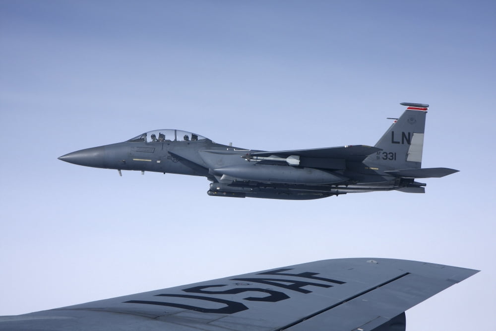 US Air Force F-15E Strike Eagle over the wing of a KC-135 Stratotanker Canvas Art - Daniel KarlssonStocktrek Images (18 x 12)