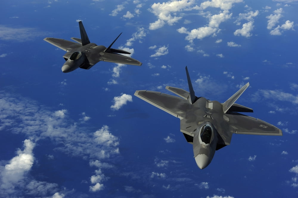 US Air Force F-22 Raptors in flight near Guam Canvas Art - Stocktrek Images (34 x 23)