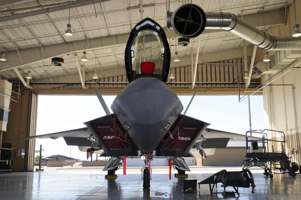 US Air Force F-22A Raptor parked in its shelter at Holloman Air Force Base Canvas Art - Riccardo NiccoliStocktrek Images (34 x 23)
