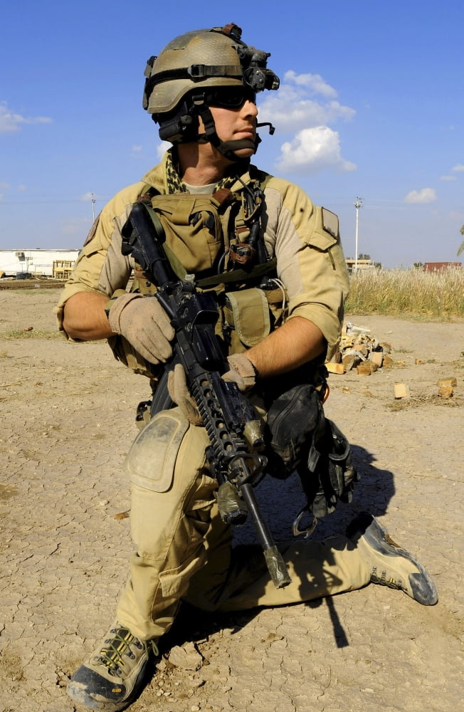 US Air Force Pararescueman conducts security for an HH-60 Pavehawk helicopter Canvas Art - Stocktrek Images (23 x 35)