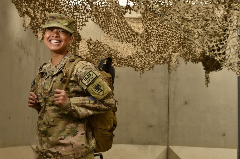 US Air Force combat medic smiles before a pre-convoy briefing Canvas Art - Stocktrek Images (34 x 23)