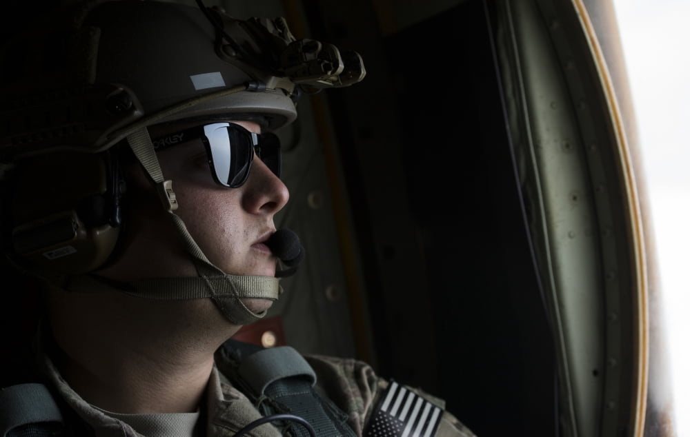 US Air Force loadmaster looks out the window of a MC-130J Combat Shadow II Canvas Art - Stocktrek Images (35 x 23)