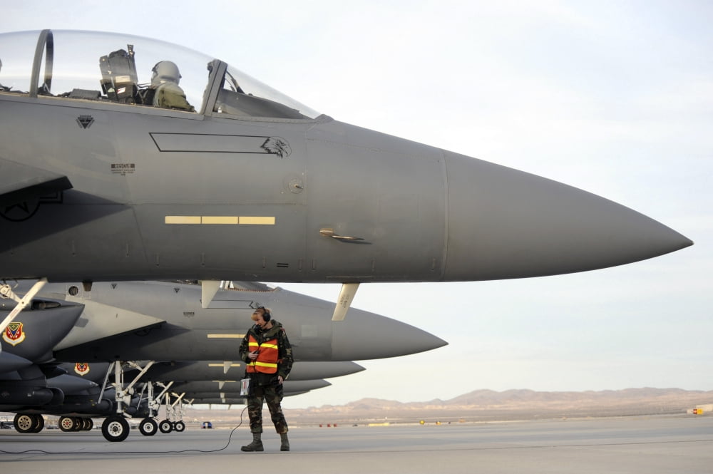 US Air Force member performs maintenance on F-15E Strike Eagles Canvas Art - Stocktrek Images (34 x 23)