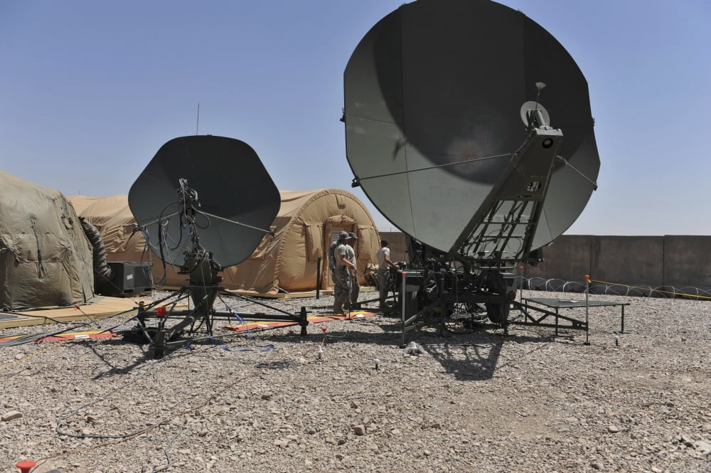 US Air Force members work on a communication satellite dish Canvas Art - Stocktrek Images (34 x 23)