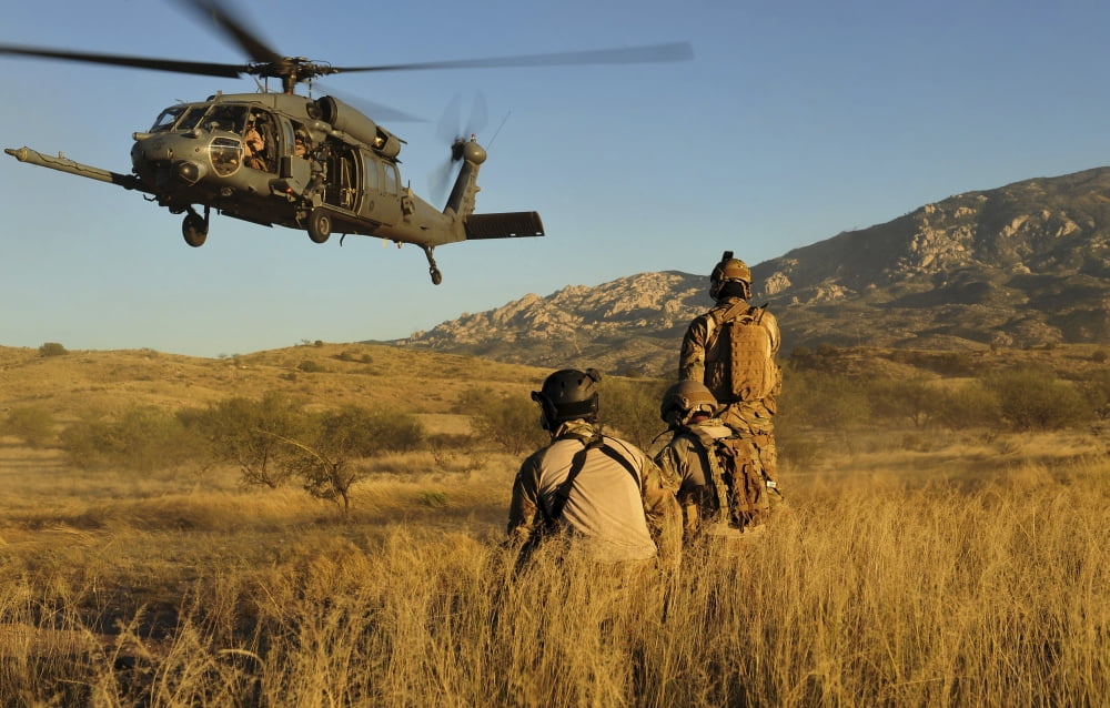 US Air Force pararescuemen signal in a HH-60 Pave Hawk for extraction Canvas Art - Stocktrek Images (35 x 23)