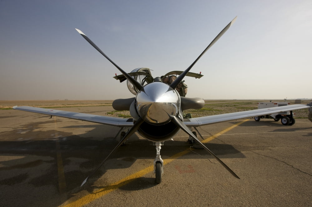 US Air Force pilots run pre-flight tests on their Iraqi Air force T-6 Texan Canvas Art - Terry MooreStocktrek Images (35 x 23)