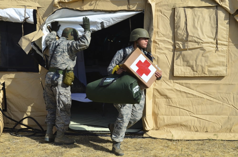 US Air Force soldier exits a medical facility with supplies Canvas Art - Stocktrek Images (35 x 23)