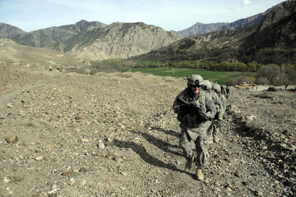 US Air Force soldiers of the Paktia Provincial Reconstruction Team walking in Afghanistan Canvas Art - Stocktrek Images (34 x 23)