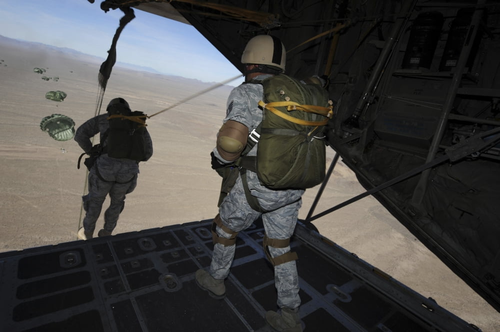 US Airmen jump from a C-130 Hercules aircraft over Nevada Canvas Art - Stocktrek Images (35 x 23)