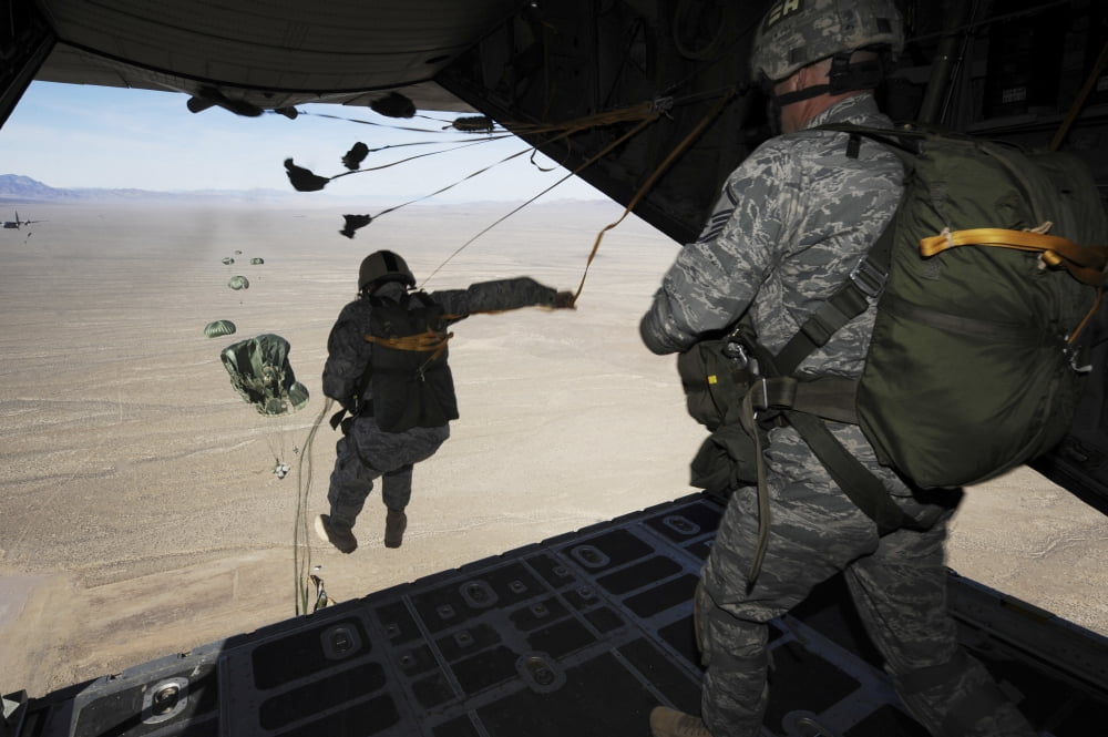US Airmen jump from a C-130 Hercules aircraft over Nevada Canvas Art - Stocktrek Images (35 x 23)