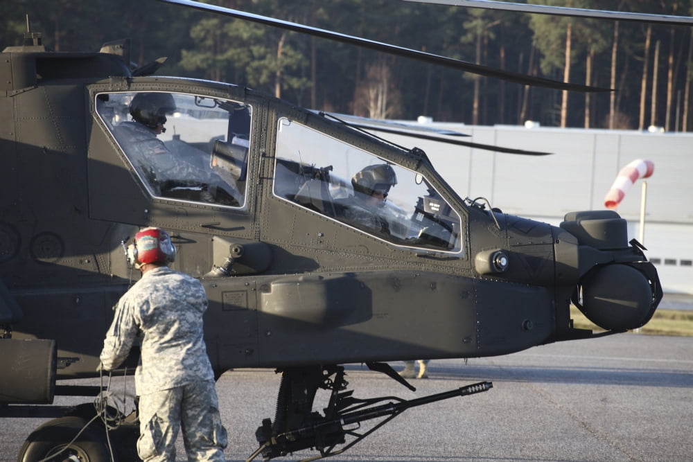 US Army AH-64D Apache helicopter pilots conduct preflight checks Canvas Art - Timm ZiegenthalerStocktrek Images (18 x 12)