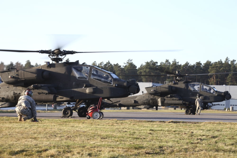 US Army AH-64D Apache helicopters prepare for takeoff Canvas Art - Timm ZiegenthalerStocktrek Images (18 x 12)