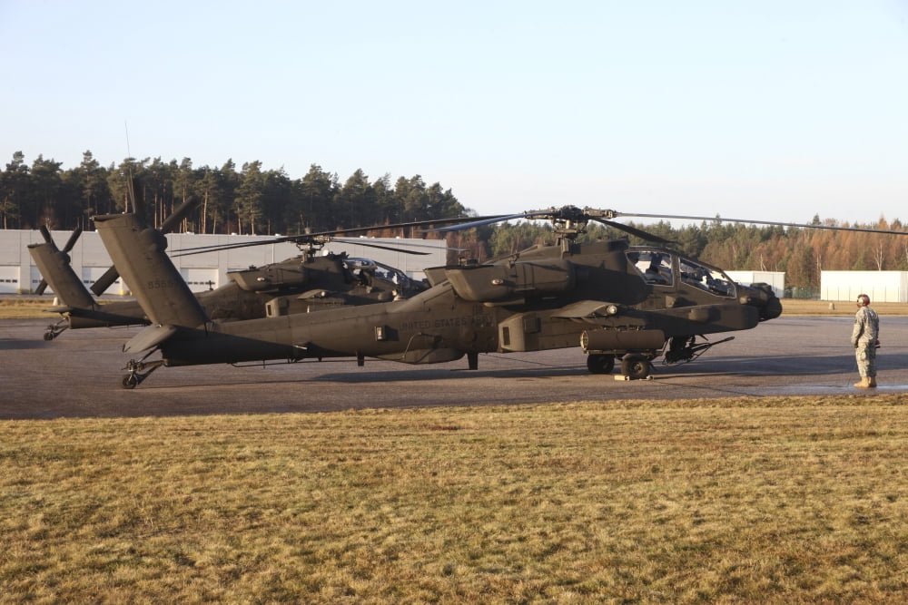 US Army AH-64D Apache helicopters prepare for takeoff Canvas Art - Timm ZiegenthalerStocktrek Images (35 x 23)