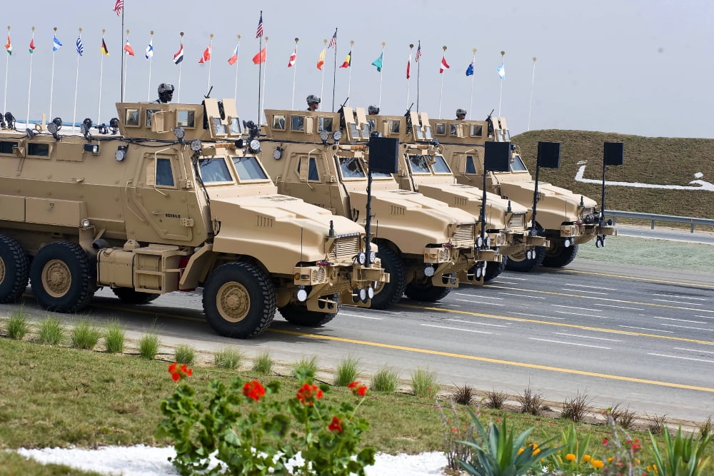 US Army Caiman vehicles take part in the 5020 Celebration parade in Kuwait Canvas Art - Stocktrek Images (34 x 23)
