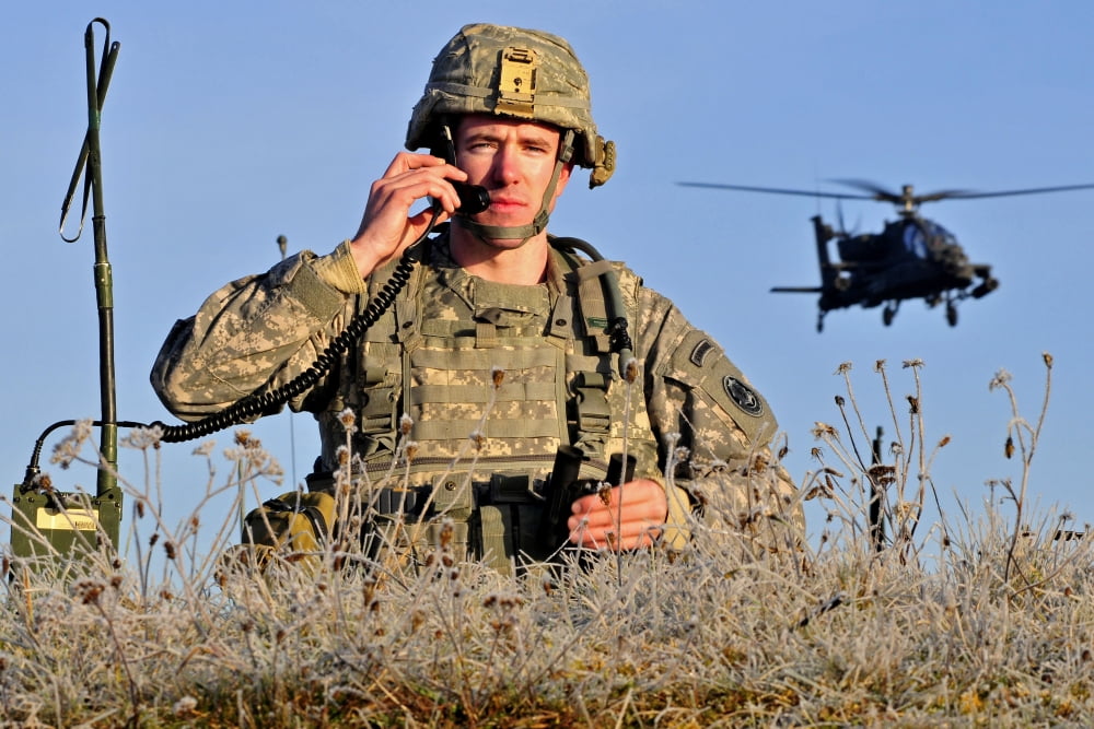 US Army Captain directs an AH-64 Apache attack helicopter strike on a target Canvas Art - Stocktrek Images (35 x 23)