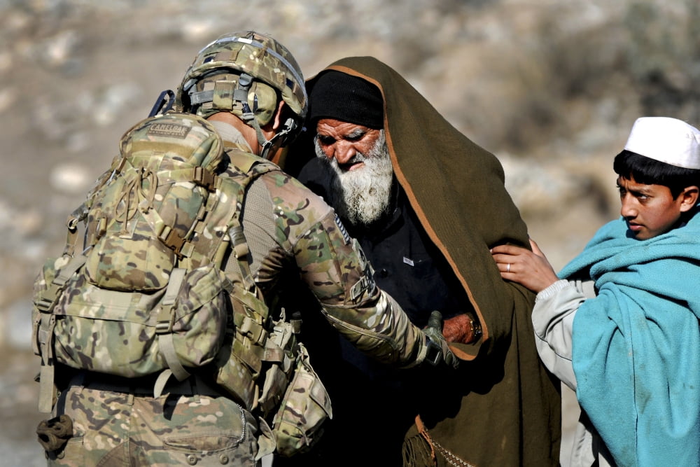 US Army Sergeant helps a town elder in Afghanistan Canvas Art - Stocktrek Images (35 x 23)