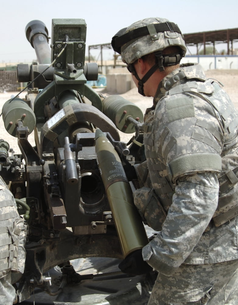 US Army Soldier loads a 105mm artillery round into a M119 Howitzer Canvas Art - Stocktrek Images (25 x 32)