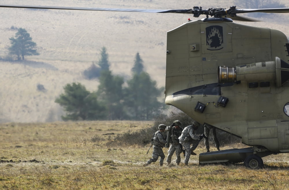 US Army Soldiers board a CH-47 Chinook helicopter Canvas Art - Stocktrek Images (35 x 23)