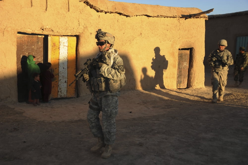 US Army Soldiers conduct a dismounted patrol through sectors of Shajoy district Afghanistan Canvas Art - Stocktrek Images (34 x 23)