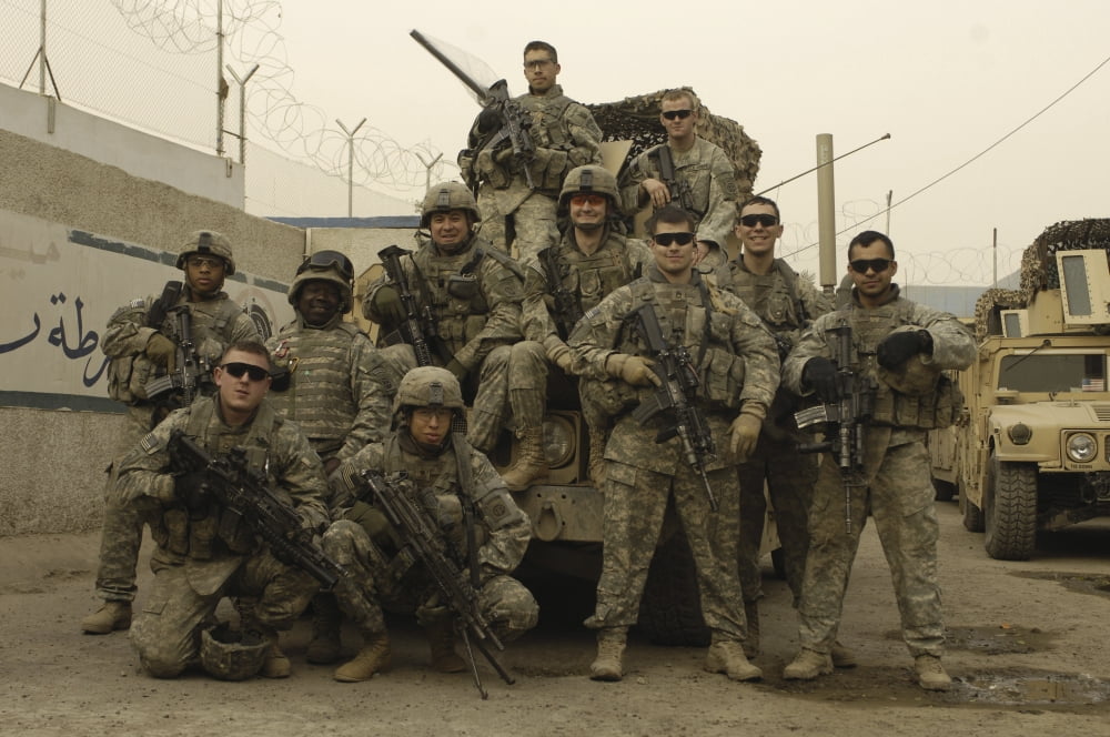US Army Soldiers pose for a photo before patrolling Baghdad Iraq Canvas Art - Stocktrek Images (34 x 23)