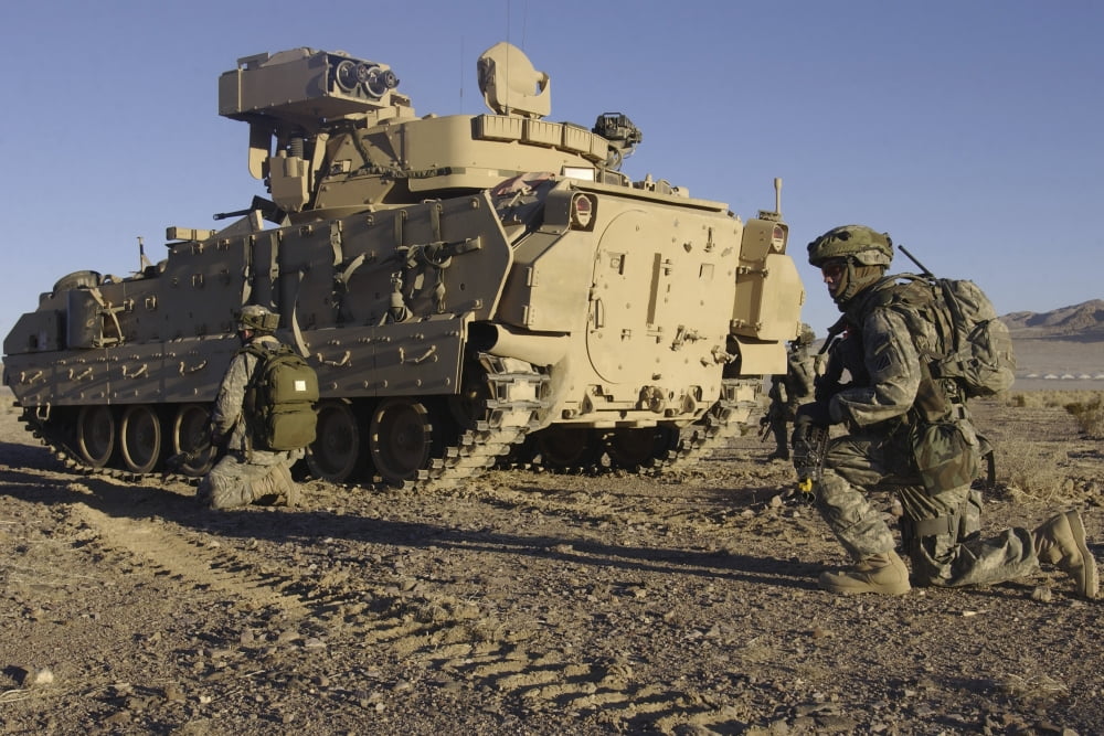 US Army Soldiers provide security with an M2 Bradley Fighting Vehicle Canvas Art - Stocktrek Images (35 x 23)