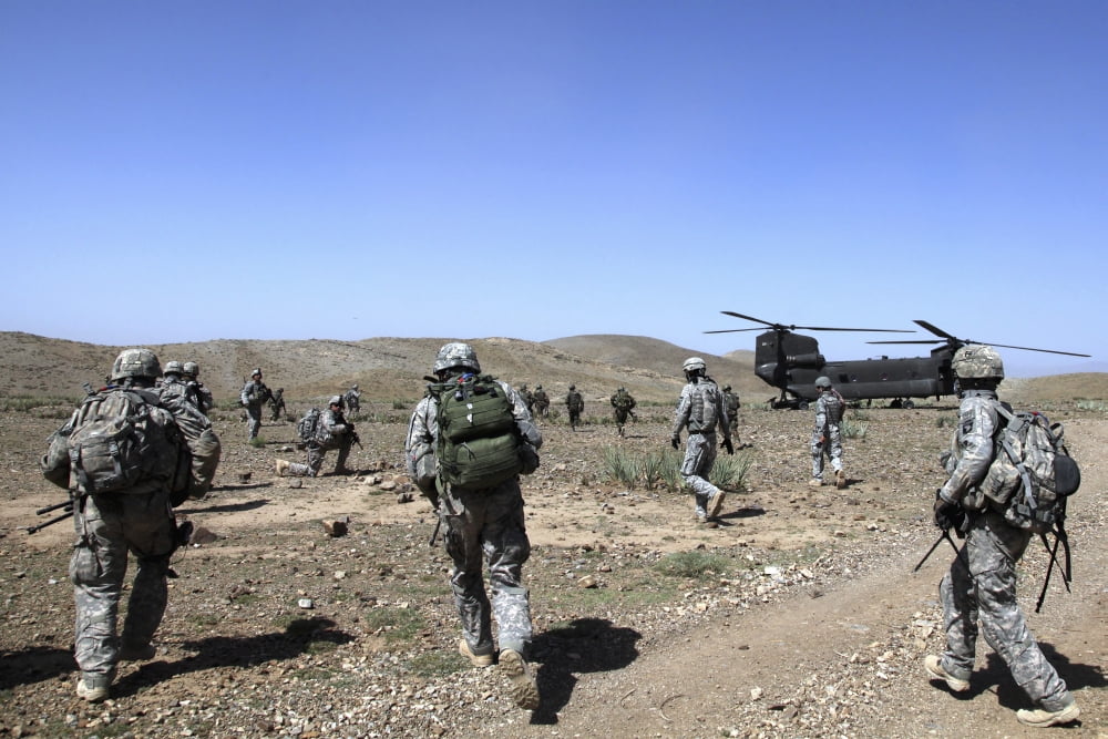 US Army Soldiers run back to their Ch-47 Chinook helicopters in Bak Khowst province Afghanistan Canvas Art - Stocktrek Images (34 x 23)