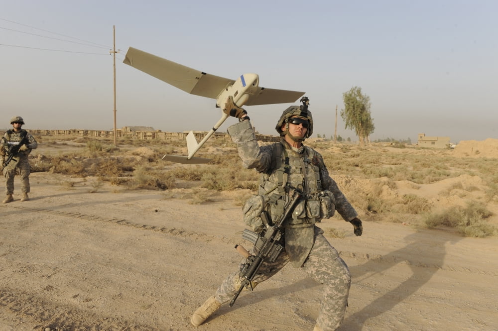 US Army Specialist launches an RQ-11 Raven unmanned aerial vehicle Canvas Art - Stocktrek Images (35 x 23)