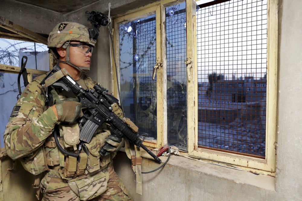 US Army Specialist monitors his surroundings from a guard post Canvas Art - Stocktrek Images (35 x 23)
