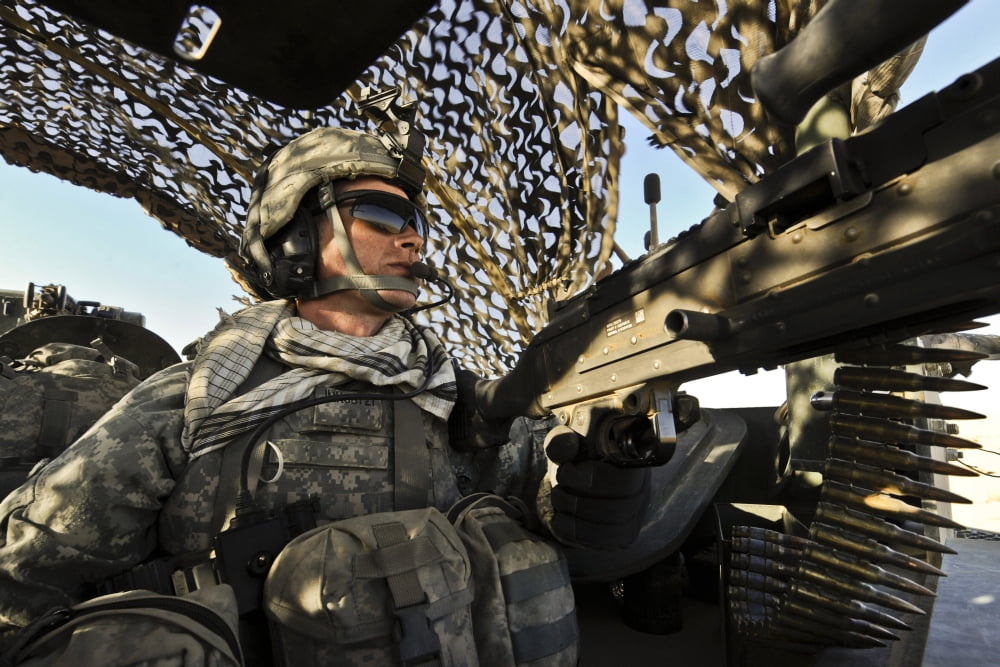 US Army Specialist provides rear security inside a Stryker armored vehicle Canvas Art - Stocktrek Images (35 x 23)