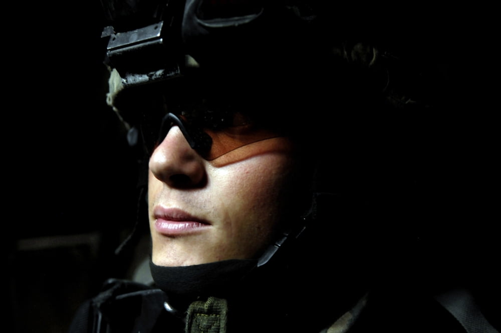US Army Specialist waits to dismount from his Stryker combat vehicle Canvas Art - Stocktrek Images (34 x 23)