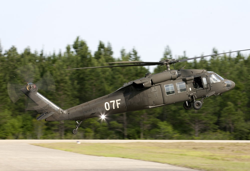 US Army UH-60L Blackhawk helicopter landing at Florida Airport Canvas Art - Erik RoelofsStocktrek Images (34 x 23)