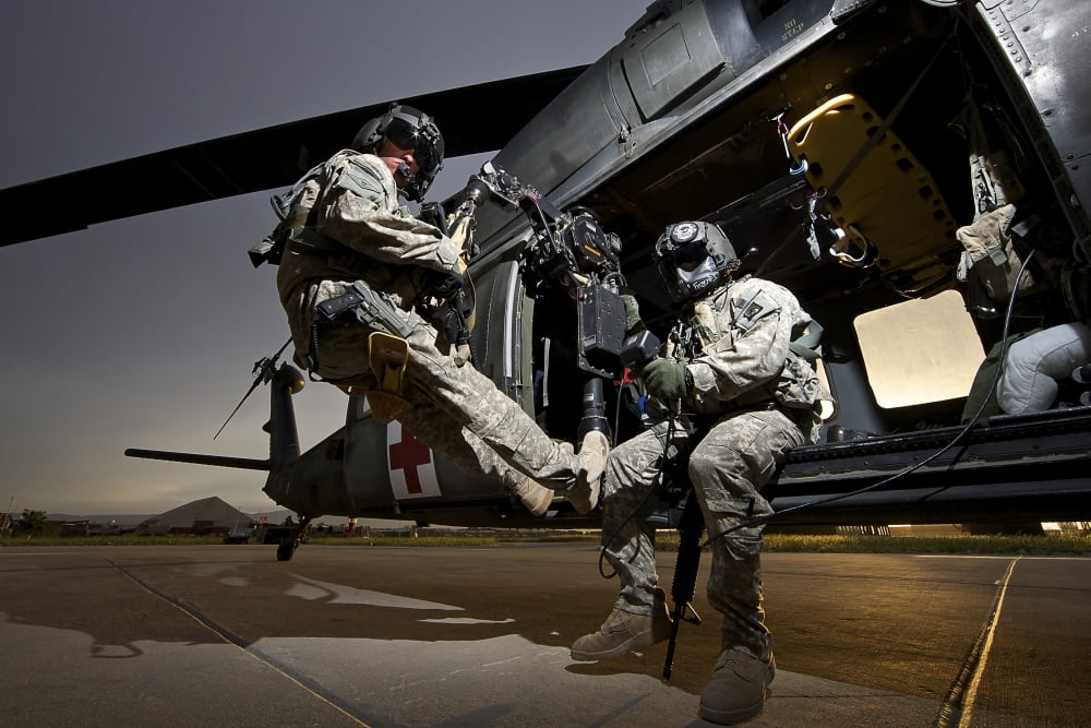 US Army crew strapped into the medevac hoist of a UH-60L Black Hawk Canvas Art - Terry MooreStocktrek Images (18 x 12)