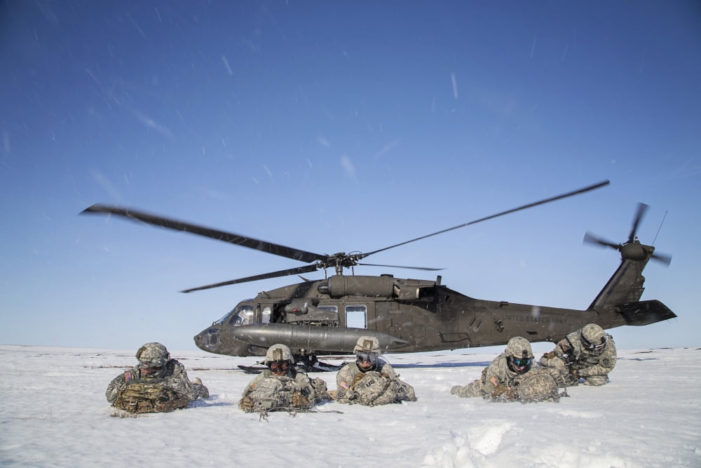 US Army paratroopers pull security after exiting a UH-60 Black Hawk Canvas Art - Stocktrek Images (34 x 23)