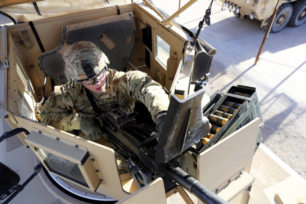 US Army soldier checks a MK-19 grenade launcher Canvas Art - Stocktrek Images (35 x 23)