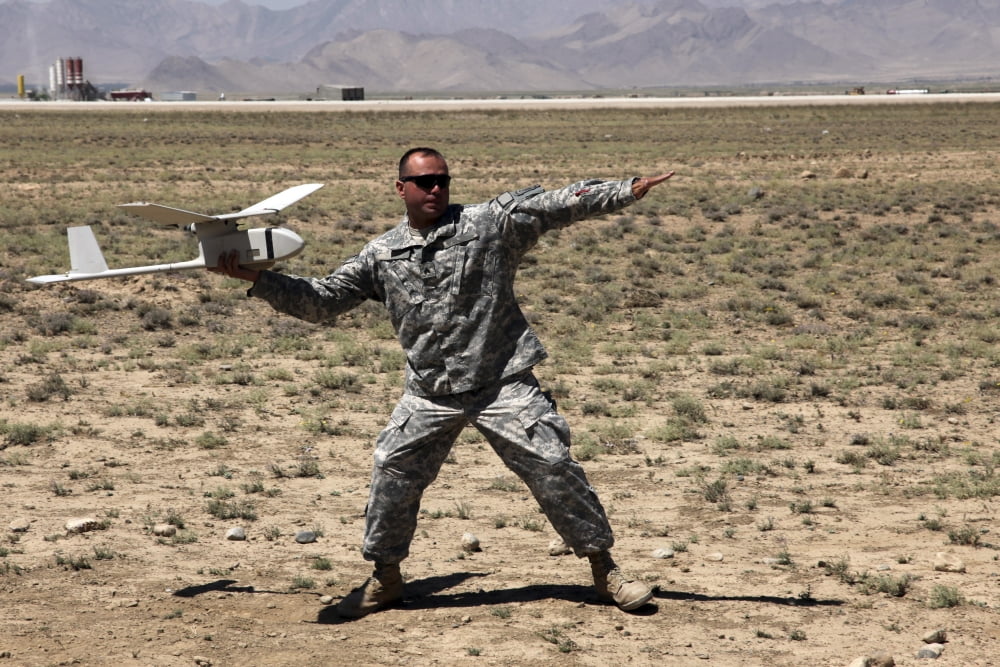 US Army soldier launches an RQ-11 Raven unmanned aerial vehicle Canvas Art - Stocktrek Images (35 x 23)