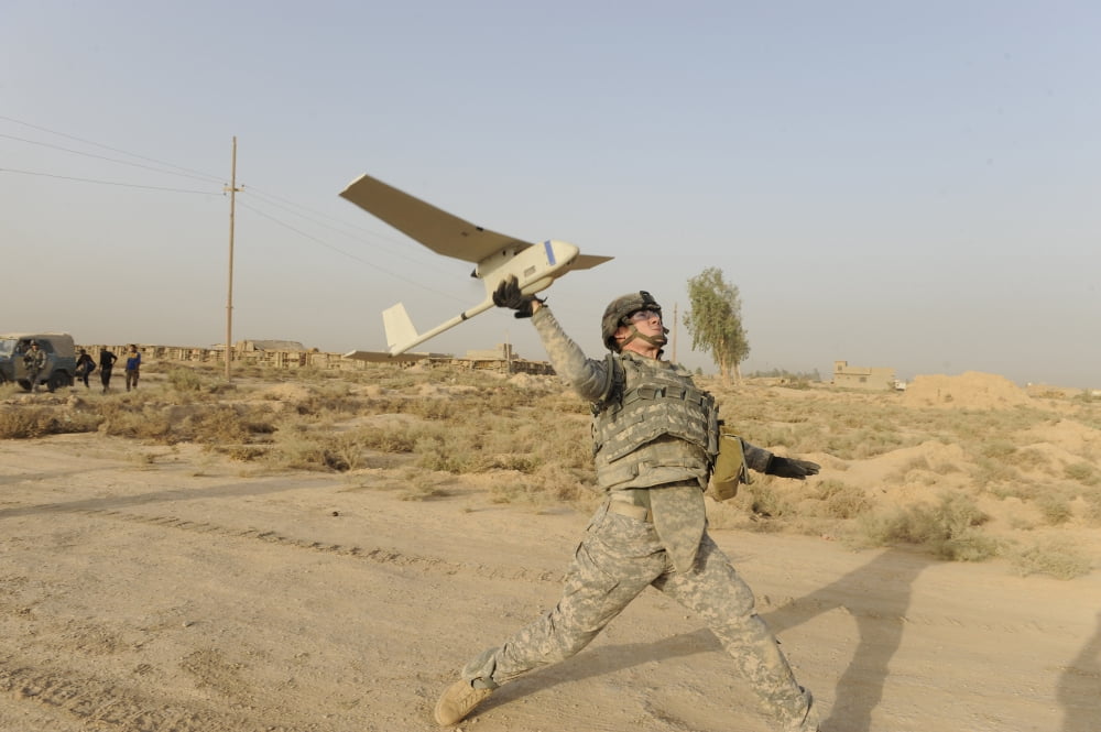 US Army soldier launches an RQ-11 Raven unmanned aerial vehicle Canvas Art - Stocktrek Images (35 x 23)